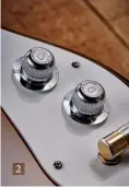  ??  ?? 2 As cute as they are the metal Mosrite-style control knobs are small and slippery. The push/ pull coil split on the tone knob is tough to lift
