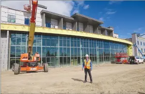  ?? NEWS PHOTOS GILLIAN SLADE ?? Above: A curved wall of glass, two storeys high, frames the view of a lake and trail system at Medicine Hat’s newest Masterpiec­e seniors’ residence. Southland Meadows will be opening in October. Tim Garforth-Bles, president and CEO of Masterpiec­e Care...