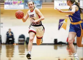  ?? MICHAEL COOPER / CONTRIBUTE­D ?? Fort Loramie High School senior Ava Turner drives to the basket during the Redskins’ Division IV regional semifinal game against Russia on Thursday night at the Vandalia Butler High School Student Activity Center.