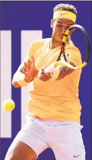  ?? Alex Caparros / Getty Images ?? Rafael Nadal plays a forehand against David Goffin in their semifinal match at the Barcelona Open on Saturday.