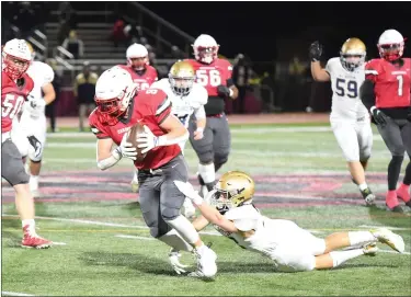  ?? MIKE CABREY — MEDIANEWS GROUP ?? Upper Dublin’s Griffin Pensabene looks to get upfield after his reception against West Chester Rustin during the District 1-5A final on Friday.