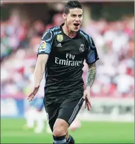  ?? PEPE MARIN / REUTERS ?? James Rodriguez celebrates scoring in Real Madrid’s 4-0 La Liga victory over Granada at Los Carmenes stadium, Granada, on Saturday.