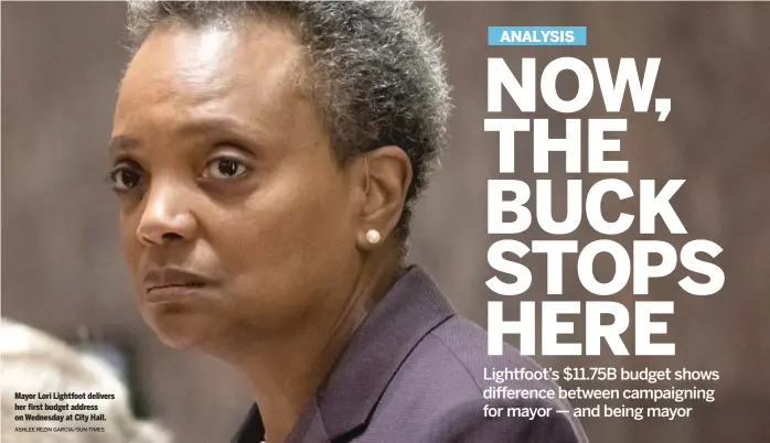  ?? ASHLEE REZIN GARCIA/SUN-TIMES ?? Mayor Lori Lightfoot delivers her first budget address on Wednesday at City Hall.