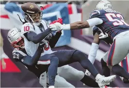  ?? STAFF PHOTO BY NANCY LANE ?? NO YOU DON’T: Stephon Gilmore breaks up a pass to Houston’s DeAndre Hopkins.