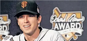  ?? Patrick Semansky / Associated Press ?? Buster Posey, here receiving the NL Hank Aaron Award at the World Series, isn’t eligible for free agency until after the 2016 season, so we have four years to watch.