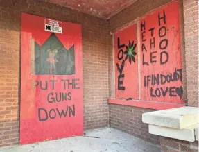  ??  ?? Messages painted last year by I Grow Chicago participan­ts call for healing and an end to the violence afflicting the Englewood neighborho­od.