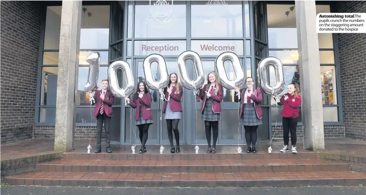  ??  ?? Astonishin­g total The pupils crunch the numbers on the staggering amount donated to the hospice