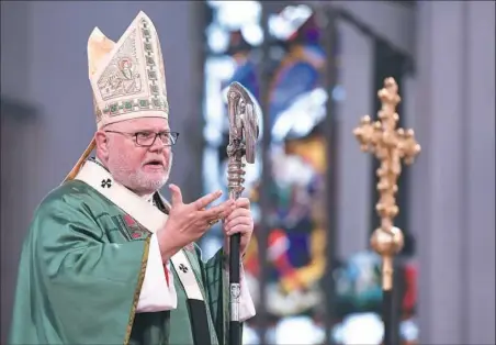  ?? Sven Hoppe/AFP/Getty Images ?? Cardinal Reinhard Marx speaks during a memorial service Sunday for the victims of the shooting spree in Munich at the Dom zu Unserer Lieben Frau Frauenkirc­he church in Munich.