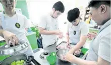  ??  ?? La Salle Green Hills students enjoying cooking class