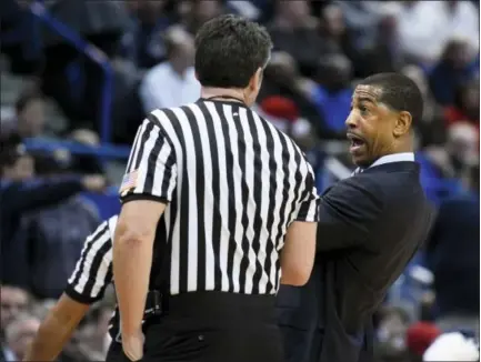  ?? FRED BECKHAM - THE ASSOCIATED PRESS ?? Connecticu­t head coach Kevin Ollie reacts to a call during the Huskies game against Auburn on Dec. 23. The Tigers edged UConn in overtime 70-67.