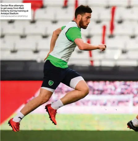  ?? STEPHEN McCARTHY/SPORTSFILE ?? Declan Rice attempts to get away from Matt Doherty during training at Antalya Stadium