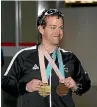  ??  ?? Paralympic skier Adam Hall returns to Auckland with his gold and bronze medals.