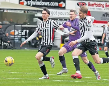  ?? ?? Kilmarnock’s Blair Alston tries to push past Coll Donaldson and Joseph Chalmers