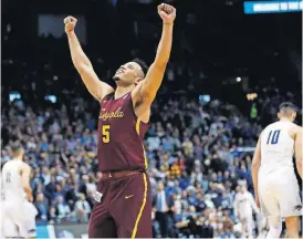  ?? PRESS] [DAVID GOLDMAN/THE ASSOCIATED ?? Loyola-Chicago guard Marques Townes celebrates victory after a regional semifinal against Nevada Thursday in Atlanta. The Ramblers won 69-68.