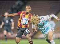  ?? PICTURE: BRUCE ROLLINSON ?? TROPHY TUSSLE: Woverhampt­on’s Dion Sanderson clears from Bradford City’s Dylan Mottley- Henry.