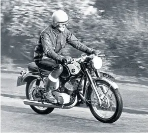  ??  ?? Mike Evans looks completely at home on the Yamaha YDS3 as he rides by during a typical photograph­ic session.