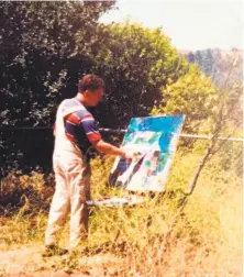  ?? William Steiger ?? Terry St. John works on a canvas in Santa Cruz, circa 1983.