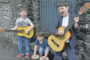  ??  ?? Oban's Three buskerteer­s. Brothers Caley, five , Sorley, three and Lachie D'Arcy, seven who were busking for charity Hope Kitchen.