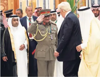  ?? AP ?? Saudi King Salman (right) and US President Donald Trump are saluted as they arrive to attend the Arab Islamic American Summit at the King Abdulaziz Conference Centre in Riyadh on Sunday.
