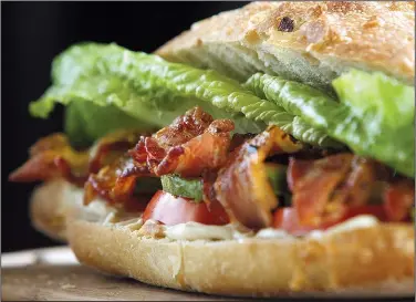  ?? Arkansas Democrat-Gazette file photo ?? Caramelize­d bacon and slices of avocado dress up almost-classic BLT.