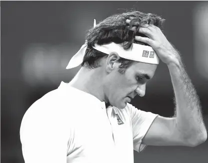  ??  ?? UPSET. Roger Federer of Switzerlan­d reacts after losing a point to Borna Coric of Croatia during their men's singles semifinals match Saturday, Oct. 13, 2018.