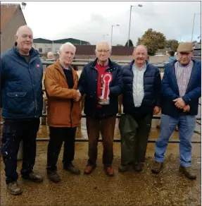  ?? ?? Right: The Annual Show and Sale of Suckled Calves at Fivemileto­wn Mart took place on Friday, 7 October 2022. Pictured are Hugh Hopper presenting the Mart Perpetual Cup to the owner of the Champion Calf, Brian Mcmahon. Also in the photograph from left are Herbie Blackburn (Judge) and the other Prizewinne­rs, Seamus Greenan and Derek Farrell.