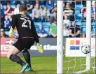  ??  ?? NO CHANCE: Fleetwood keeper Alex Cairns watches helplessly