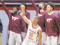  ?? ASSOCIATED PRESS MATT GENTRY/ ?? Virginia Tech’s Jalen Cone, who is averaging 12.9 points per game as a reserve and is shooting 39.7% this season from beyond the arc, follows through on a 3-point basket Dec. 19 against Coppin State.