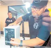  ?? Photo / Warren Buckland. ?? Music teacher aides Talitha Blake and Tukotahi Raki set up Flaxmere College’s new recording studio.