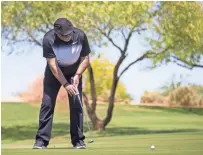  ?? JOHANNA HUCKEBA/ THE REPUBLIC ?? Former Cardinals head coach Bruce Arians putts on the course at the Arizona Celebrity Golf Classic on Saturday at the Whirlwind Golf Club.