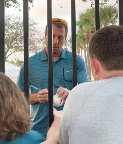  ?? RON BLUM/AP ?? Mets pitcher Max Scherzer signs autographs for fans after players and MLB concluded labor talks Saturday in Jupiter, Fla.