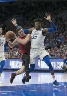  ?? CHRIS SZAGOLA — THE ASSOCIATED PRESS ?? The Sixers’ Robert Covington, here defending Miami’s Goran Dragic in the playoffs last spring, will line up as the starting small forward for the Sixers in Tuesday’s season opener. He’s not the starter the Sixers were aiming for, but could he be the one they end up needing?