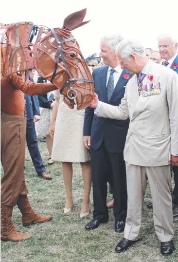  ?? Picture: GETTY ?? King Philippe of Belgium and Britain’s Prince Charles with War Horse, from the stage show of the same name, during their visit to Exhibition Field at the Passchenda­ele Memorial Park.
