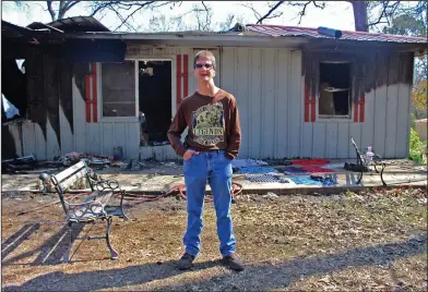  ?? Kaitlyn Rigdon/News-Times ?? Rescue: Danny Austin stands in front of 247 Nick Springs Road, where a fire occurred Friday. Austin saw the smoke coming from the house and ran inside to get his neighbor out. Austin is 41-years-old and was diagnosed with cerebral palsy when he was born.