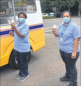  ??  ?? Staff tuck in to their free ice creams