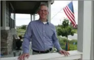  ?? DAVID ZALUBOWSKI - THE ASSOCIATED PRESS ?? Software engineer Joe Wilson poses for a photo outside his home in Highlands Ranch, Colo.