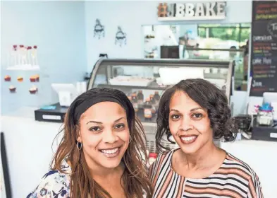  ??  ?? Sisters Courtni Johnson, left, and Jami Harbin fulfilled their dream of opening a business with Jaybear Bake Shop. The grand opening was May 26. The bakery offers cupcakes, cookies, custom cakes and special features, such as candy apples, fruit jams...