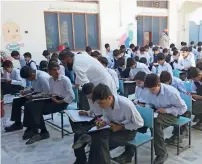  ?? AFP file ?? Students sit for a final exam in Mingora, the capital of Swat valley. The government is all set to announce an initiative to increase the literacy rate in the country. —