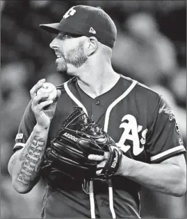  ?? TED S. WARREN/AP ?? A’s starter Mike Fiers. who used to pitch for the Astros, exposed his former team.