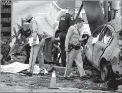  ?? Jason Armond
/ Los Angelestim­es /TNS ?? California Highway Patrol and other officials investigat­e a fiery crash in which multiple people were killed at the intersecti­on of West Slauson and South La Brea avenues onthursday, Aug. 4, in Los Angeles.