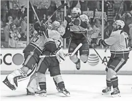  ?? MARK HUMPHREY/AP ?? Predators players including defenseman P.K. Subban, second from right, celebrate with goalie Pekka Rinne, left, after winning Game 6 of the Western Conference finals Monday.