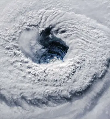  ?? ESA / NASA VIA GETTY IMAGES ?? Hurricane Florence churns through the Atlantic Ocean toward the U.S. East Coast on Wednesday. Florence was expected to stall along the coast of the Carolinas, bringing with it torrential rain and high winds through Thursday.