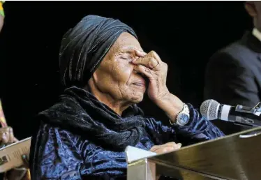  ?? Picture: WERNER HLLS ?? BIDDING ADIEU: Sister Nosipho Mshumpela-Molomo, one of two surviving ‘ Nightingal­es’, breaks down during the funeral of Sister Kholeka Tunyiswa at the Nangoza Jebe Hall