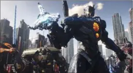  ?? LEGENDARY PICTURES — UNIVERSAL PICTURES VIA AP ?? This image released by Universal Pictures shows a scene from “Pacific Rim Uprising.”