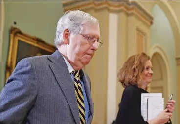  ?? PATRICK SEMANSKY/ASSOCIATED PRESS ?? Senate Majority Leader Mitch McConnell of Kentucky departs the chamber Monday after the impeachmen­t trial of President Donald Trump ended for the day.
