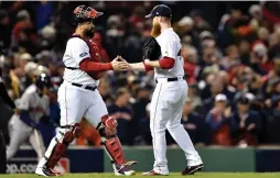  ?? (Bob DeChiara/USA Today Sports/Reuters) ?? BOSTON RED SOX catcher Christian Vazquez and relief pitcher Craig Kimbrel celebrate their win over the Houston Astros in game two of the 2018 ALCS playoff baseball series at Fenway Park.