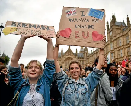  ?? PHOTO: GETTY IMAGES ?? Protesters gather outside the Houses of Parliament in London yesterday to demonstrat­e against the European Union referendum result.