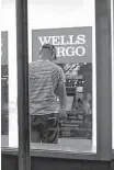  ?? Patrick Sison / Associated Press file ?? Wells Fargo reported a lower number of new checking accounts being opened.