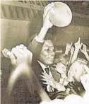  ?? Courtesy photo / Aggieland yearbook ?? Fans greet Hugh McElroy at the airport after his huge TD late in the game helped A&M defeat LSU in 1970.