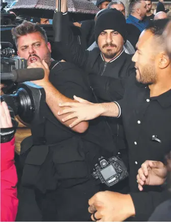  ??  ?? Jarryd Hayne supporters clash with the media out the front of Newcastle Court after he was sentenced. Picture: NCA NewsWire / Peter Lorimer